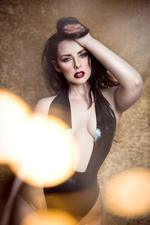 Latex Elissa Bodysuit in Black with Translucent Natural panels.