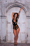 Latex Cage bodysuit in Black and Translucent Natural.